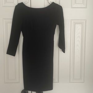 Mini little black dress with open back and 3/4 sleeves